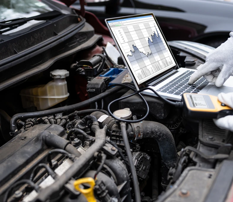 Car engine analysis with laptop and device